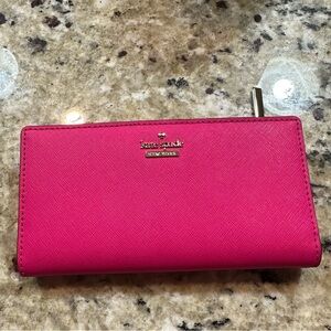 Kate Spade pink bifold wallet. Brand new, never used. No tears, scuffs or smells